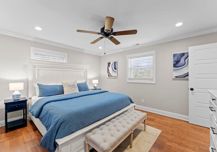 Main level primary bedroom with king bed and en-suite bath. 