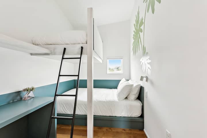Bedroom 9: a queen bed and a twin bunk, upstairs. The hall bath is steps away.