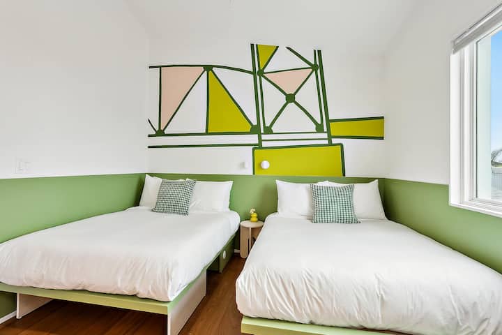 Bedroom 7: two full beds, upstairs. It shares a jack-and-jill bath with Bedroom 8.