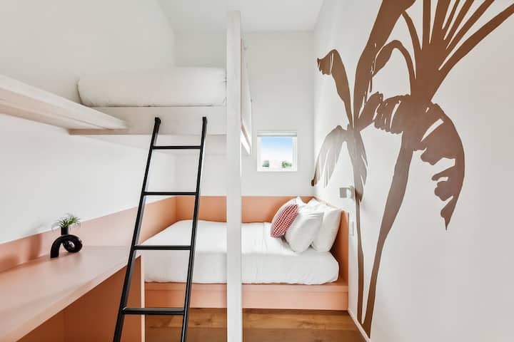 Bedroom 11: a full bed and a twin bunk, upstairs. The hall bath is steps away.