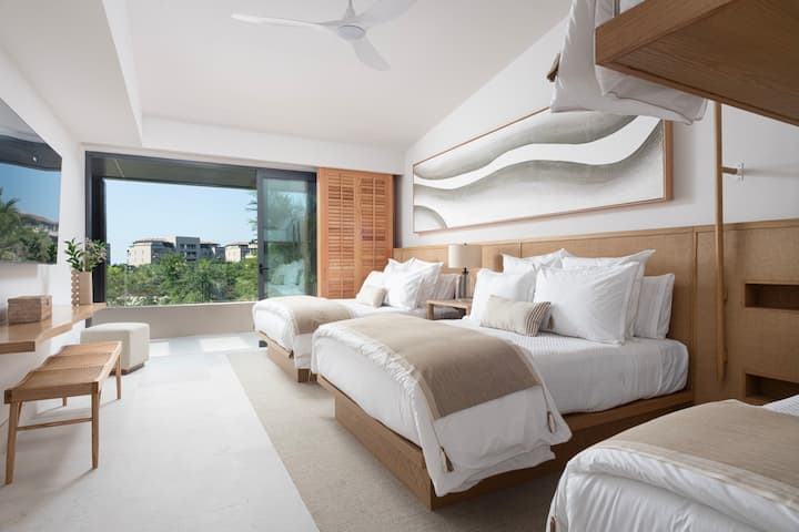 Bedroom two (2 Queen beds & 2 Bunk twin beds) + golf course view terrace +  en-suite bathroom