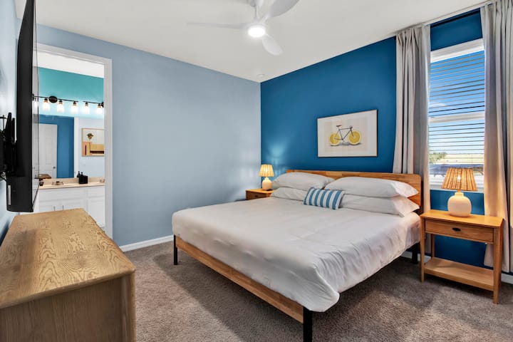 Bedroom 5 features a king bed, TV, and an ensuite bathroom.