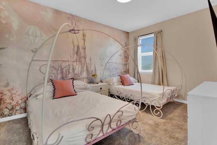 Bedroom 7 features two full beds, and a TV.