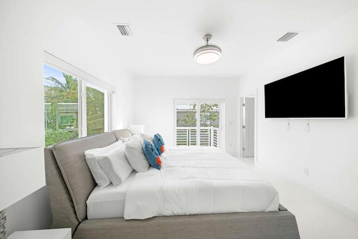 Sun-drenched elegance with plush bedding and serene views—your ideal getaway awaits!