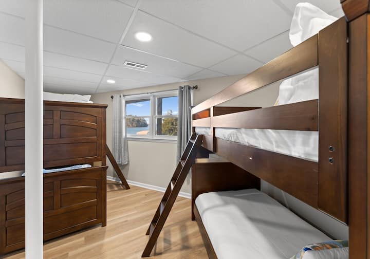 Lower level bunk room with two sets of twin bunk beds. 