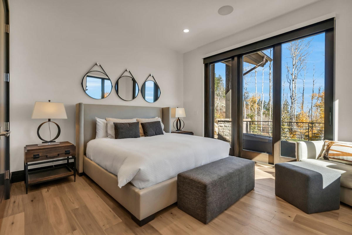 Bedroom with One Bed, Bedside Table, Lamp and Sliding Door to the Balcony