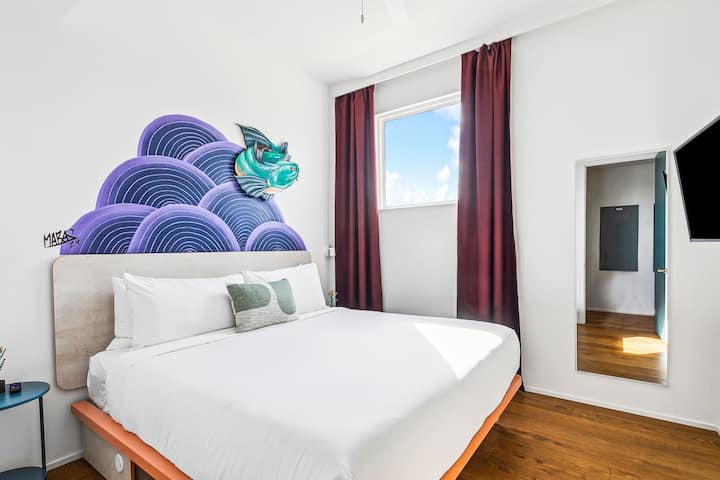 Bedroom 4: king bed, downstairs, with a private en-suite bath.