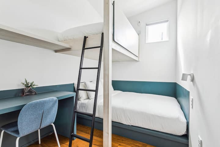 Bedroom 9: a queen bed and a twin bunk, upstairs. The hall bath is steps away.
