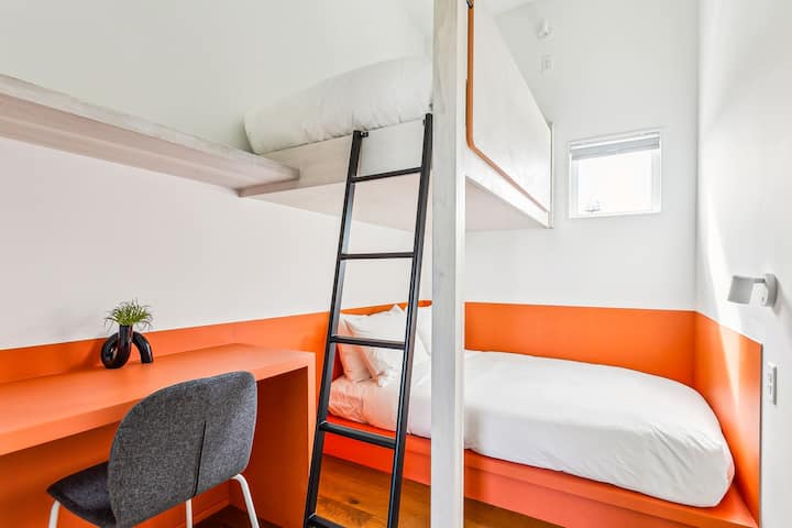 Bedroom 11: a full bed and a twin bunk, upstairs. The hall bath is steps away.