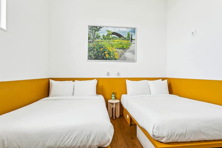 Bedroom 8: two full beds, upstairs. It shares a jack-and-jill bath with Bedroom 7.