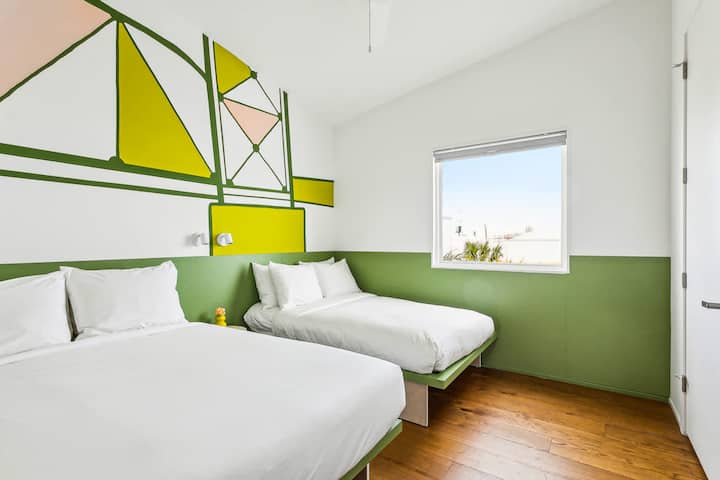 Bedroom 7: two full beds, upstairs. It shares a jack-and-jill bath with Bedroom 8.