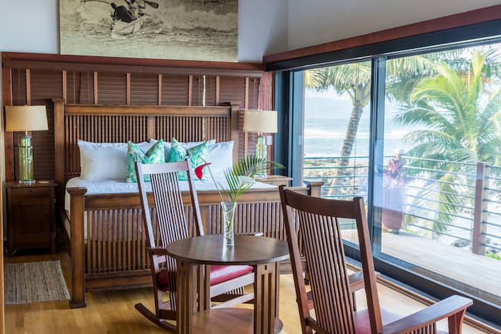 Rest in comfort in the primary suite with tropical views and thoughtful decor.