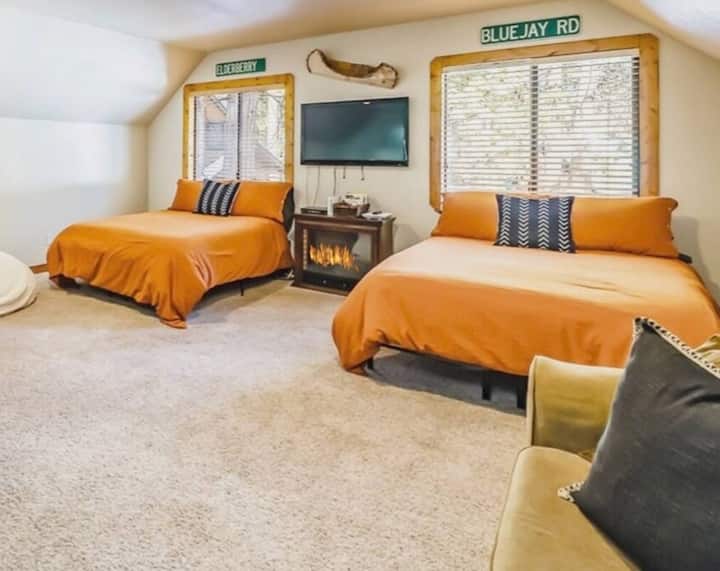 Bedroom 3 is a Large open loft with 2 full beds, 2 bean bags, and a pull-out couch. Perfect for couples and families! TV, Wii, Netflix, Old school video game, and board games! TV's have streaming devices with Netflix, Hulu, Amazon Prime, and more.