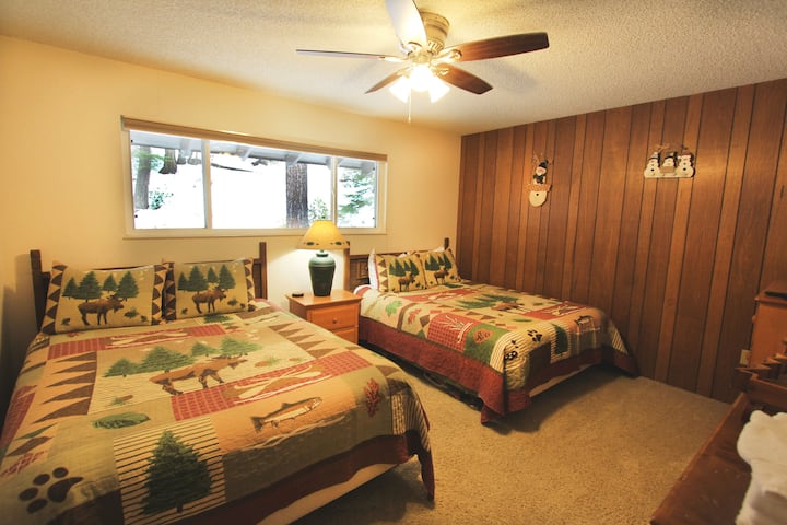 The kids get their own room with two queen beds.