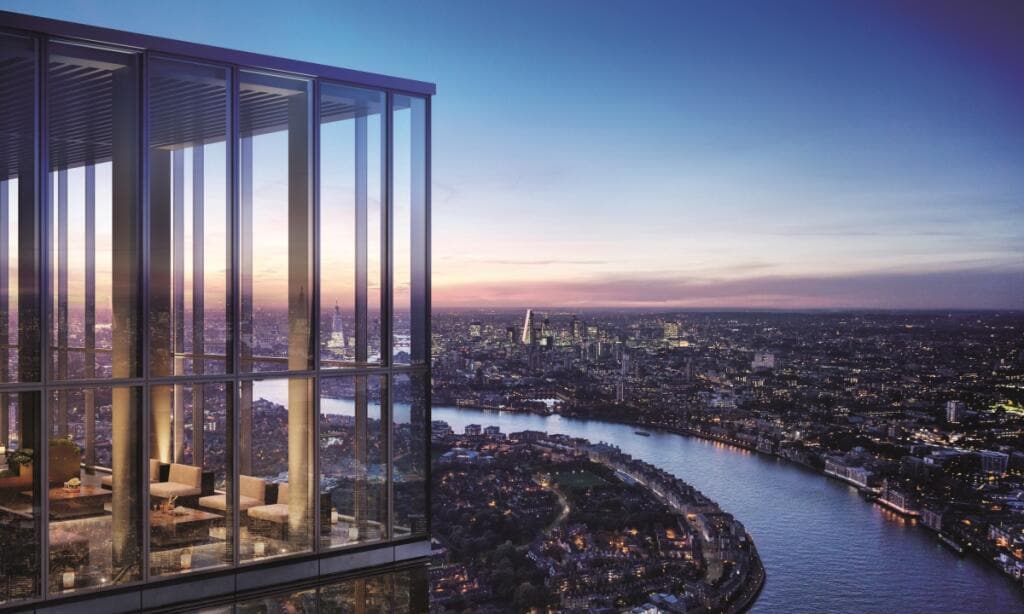 A modern glass facade frames an expansive balcony overlooking London's skyline during twilight. The River Thames meanders below, with city lights beginning to glow. Floor-to-ceiling windows provide unobstructed views of iconic buildings in the distance, inviting a sense of openness and tranquility.
