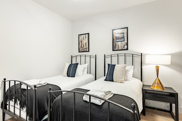 Bedroom 2 features two twin single beds.