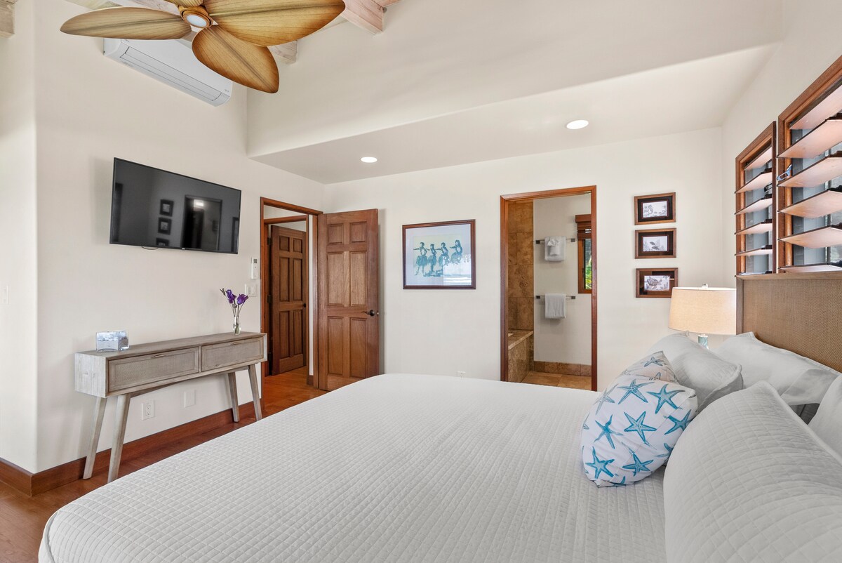 Bright and airy bedroom with a king-size bed and tropical-inspired décor.