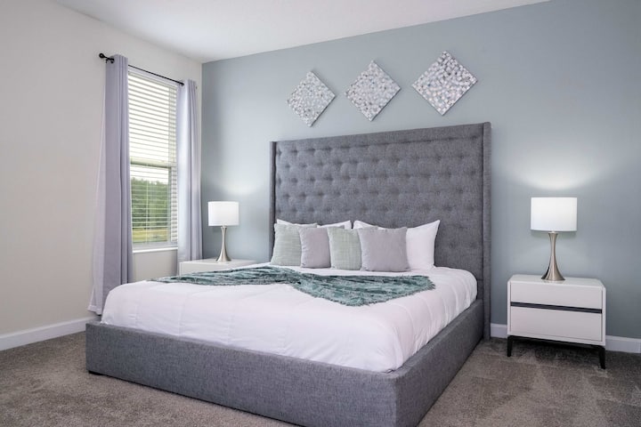 [2nd Floor] ️ Suite Dreams Await – King master suite with a luxury tufted headboard and walk-in closet. 