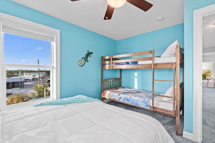 Wake up to breathtaking marina views in this vibrant, beach-inspired retreat!