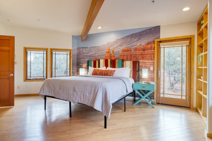 Primary bedroom features a king bed, TV, outdoor access, and an ensuite bathroom.