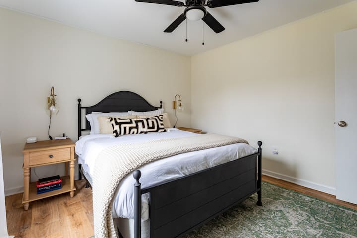 This bedroom also includes a ceiling fan and TV 