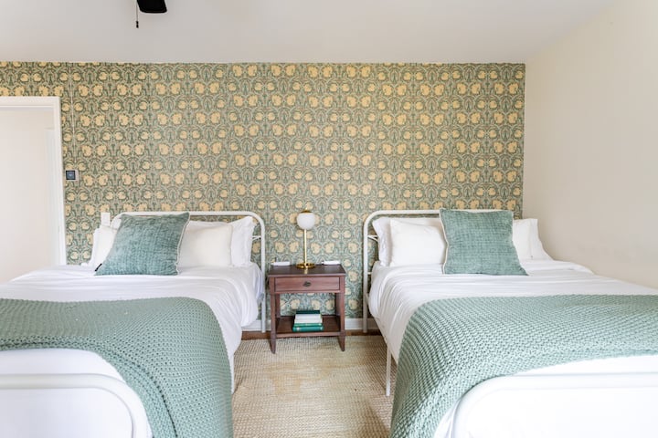 This bedroom incudes two full beds 