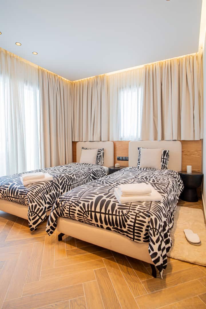 Quarto 2 com dois colchões de tamanho completo e acesso ao terraço