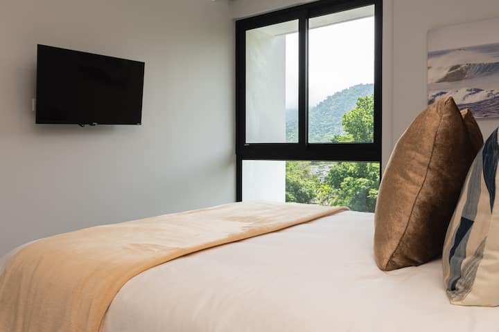 TV with included streaming apps, mountain views, and fresh linens provided.