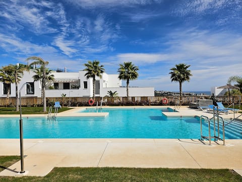 Garden level Pool front apartment in Casa Banderas