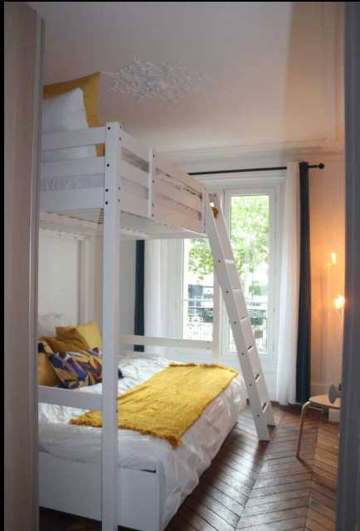 A bedroom with a queen size bed, a double bed, guaranteeing soothing nights of sleep in a stylish setting.