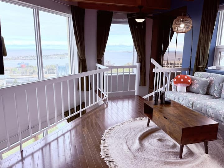 Wake up to the view over Lake Superior from the primary bedroom loft.