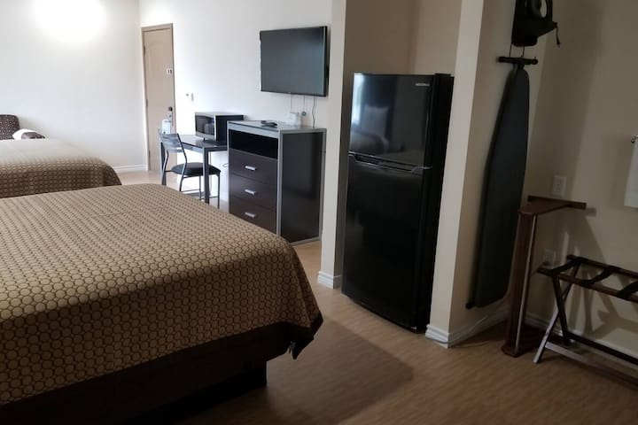 Come and go effortlessly with a spacious room and mini-fridge.