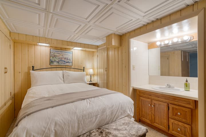 Bedroom 3 features a full bed, sink, and vanity.