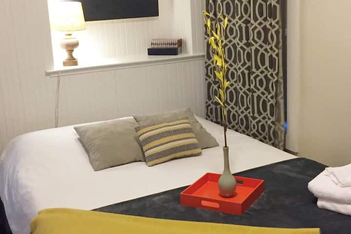 upstairs bedroom  with a queen size bed
