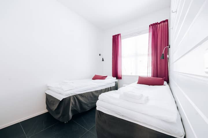Dormitorio del apartamento n.º 5 con dos camas separadas