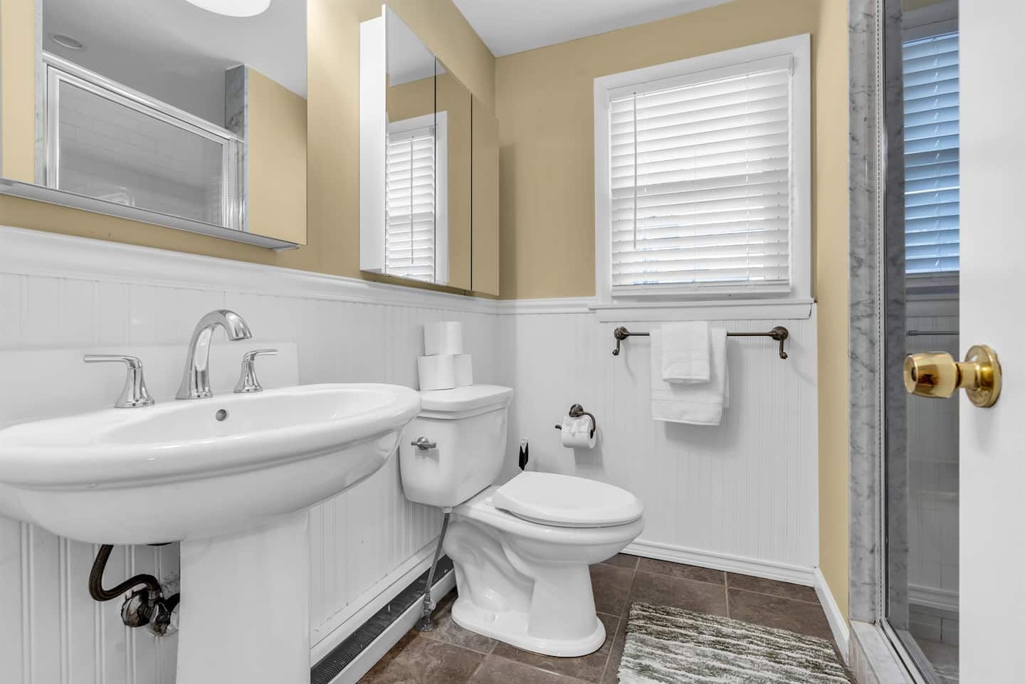 Master bathroom with tiled shower and generous amounts of toilet paper, shampoo, conditioner and body wash to make packing a breeze!