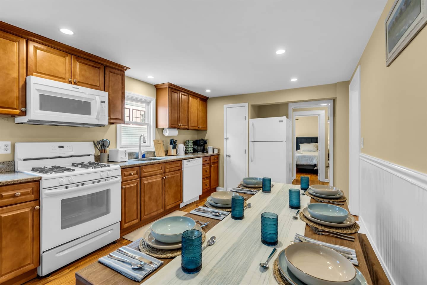 Coastal kitchen with 6 seat table with bench seating for comfort and convenience!