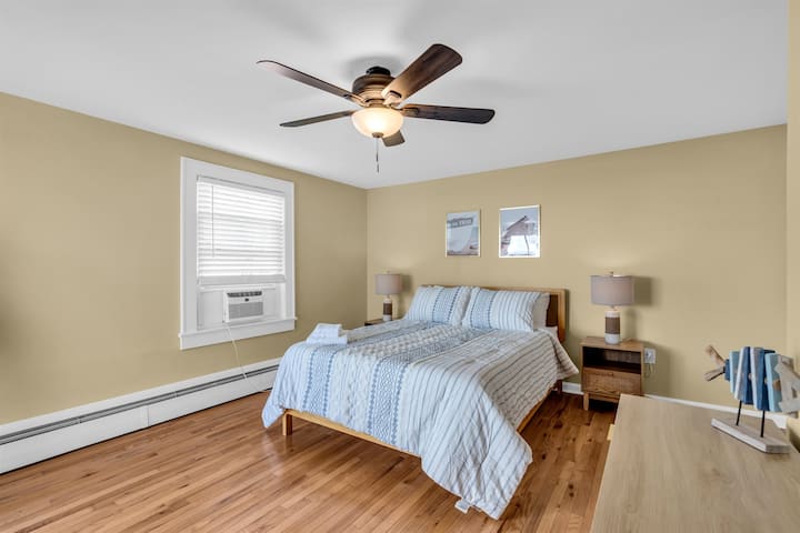 The queen bedroom with a memory foam mattress and coastal decor