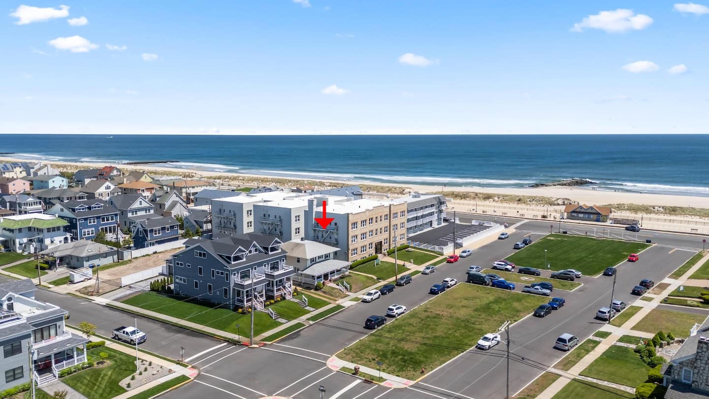 Aerial view with the house marked by a red arrow, one block from the boardwalk and the Atlantic