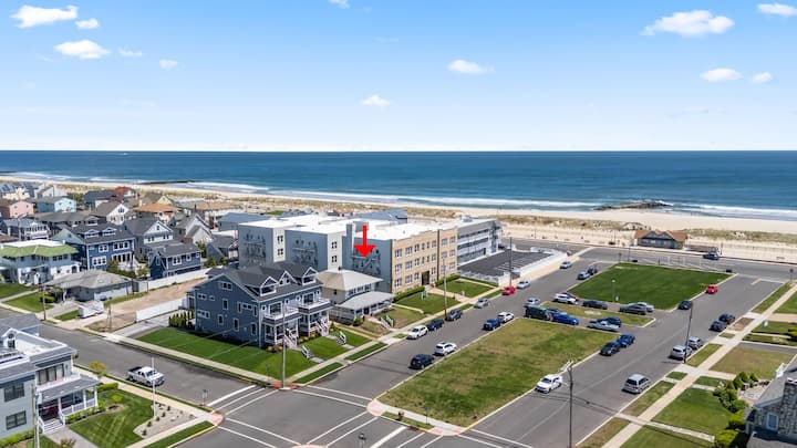 Aerial view with the house marked by a red arrow, one block from the boardwalk and the Atlantic