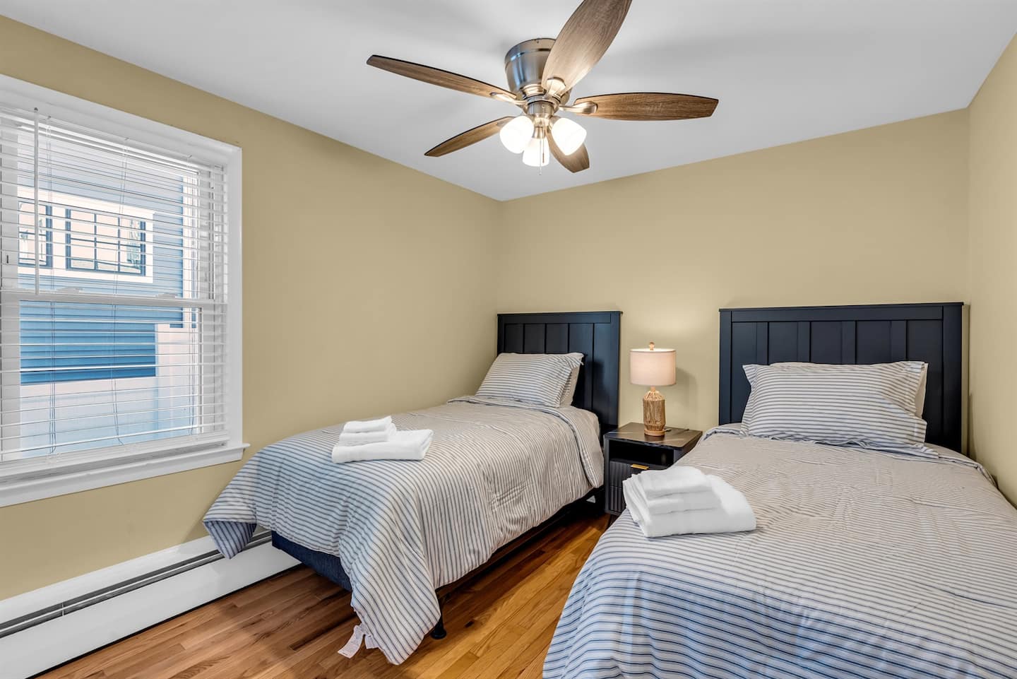 The twin bedroom with two matching beds, styled for kids or two solo travelers