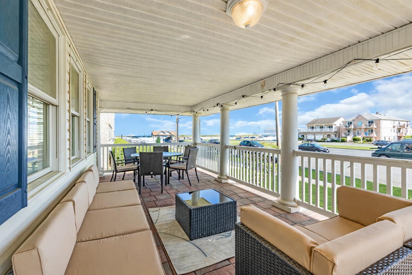 The wraparound porch and the house's welcome sign