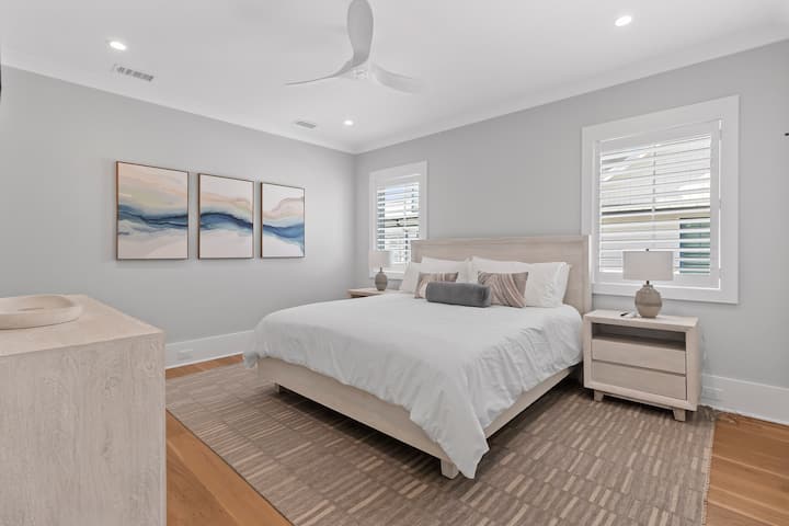 Bedroom 5 features a California king bed, TV and an ensuite bathroom.