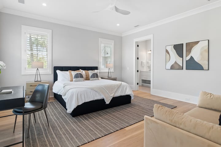 Bedroom 3 features a California king bed, ensuite bathroom, TV and a walk-in closet.