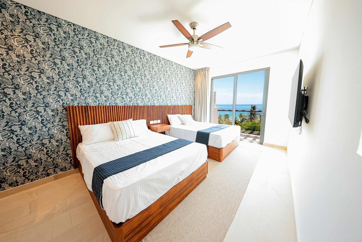 Chambre avec deux lits doubles 