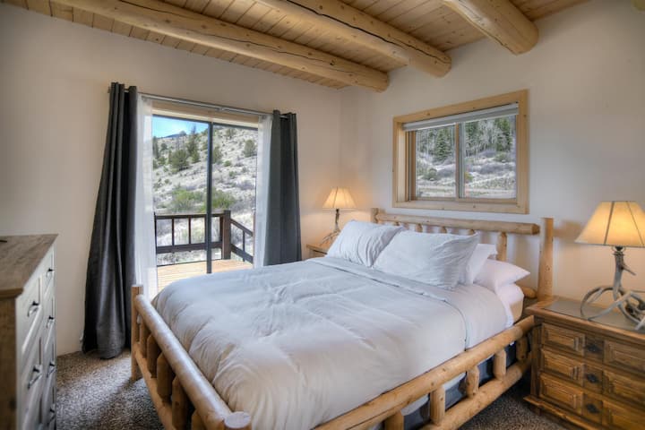 Queen bed on main floor with private deck.