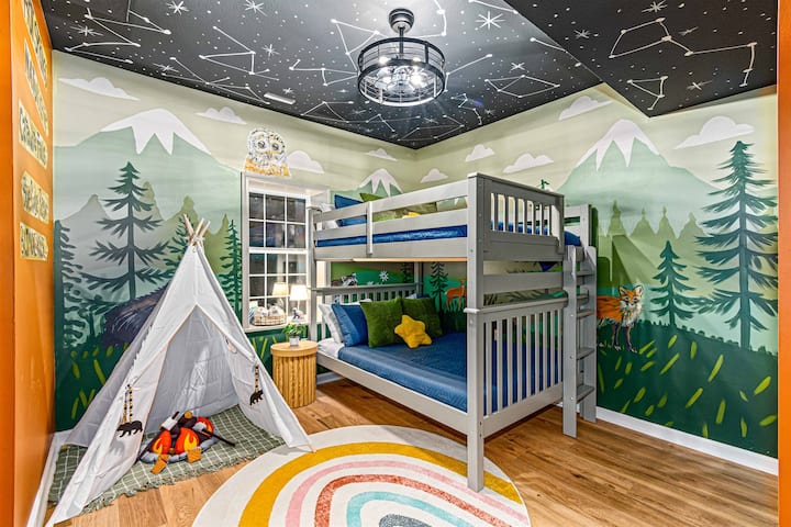 Adventure awaits in this full-over-full bunk room, designed with a cozy forest and mountain theme—complete with a playful indoor tent for little explorers.