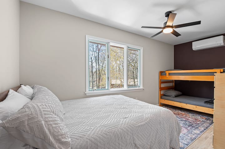 Inviting bedroom with ceiling fan and cozy area rug for relaxing mountain nights