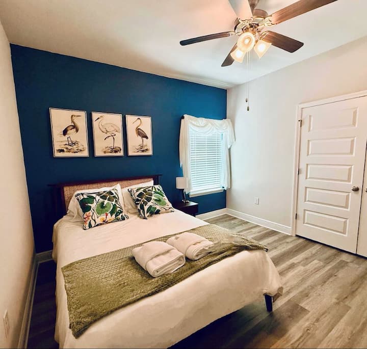 Cozy queen bedroom with high-end linens—peaceful retreat after exploring Port St. Joe.