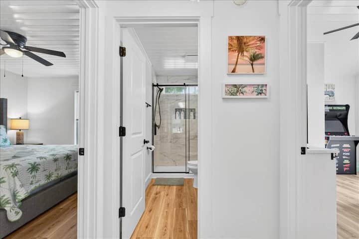 Guest Bathroom: This beautifully updated guest bathroom includes a modern glass-enclosed shower and is centrally located between the guest king and bunk bedrooms.